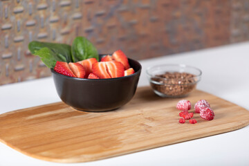 Strawberries with raspberries and cereals.