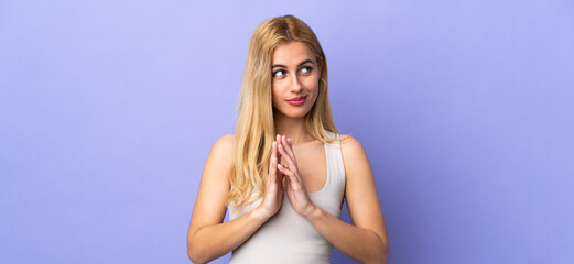 Young Uruguayan blonde woman over isolated background scheming something