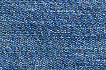 Macro photo of blue jeans material. Fabric background.