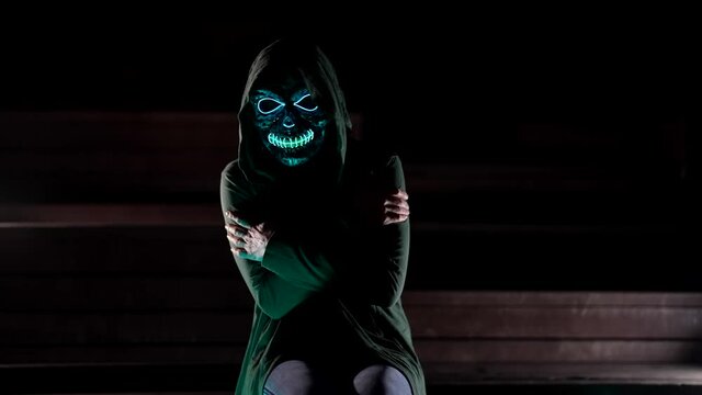 cold in otherworld, spirit is feeling cold and freezing after death, person with glowing skull in darkness