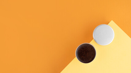 Homemade cosmetics with coffee scrub and oil. Set of home SPA eco-friendly cosmetic products. Anti-cellulite cosmetic for peeling and spa self-care on a beige yellow background. wellbeing concept