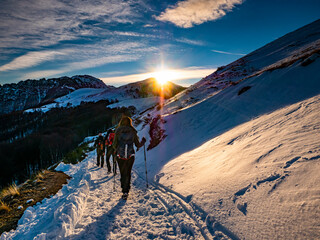 Trekking scene at sunset on Lake Como Alps