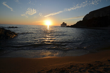 Tramonto sulla spiaggia di Masua con lo scoglio Pan di Zucchero sullo sfondo - Mare di Sardegna