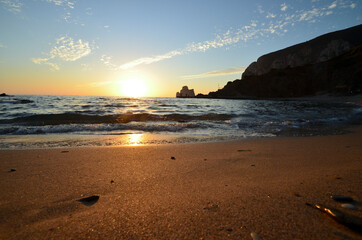 Tramonto sulla spiaggia di Masua con lo scoglio Pan di Zucchero sullo sfondo - Mare di Sardegna