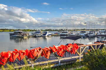 Boats moored at the marina in Ryn (ger. Rhein) at Ryn Lake, Masuria, Poland