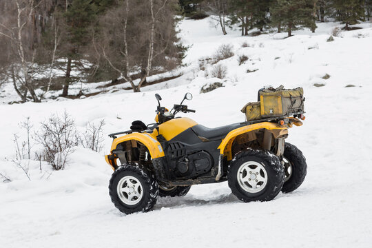 All-terrain vehicle. Quad vehicle in the snow. 

