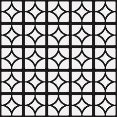 White quarters of a circle on a black background. The circles are divided into four parts to create a mosaic.