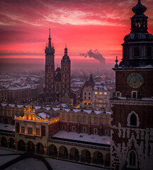 Fototapeta premium Main Square (Saint Mary's Basilica, Sukiennice - Town Hall, Town Hall Tower) in Krakow during magic dawn in winter, Poland