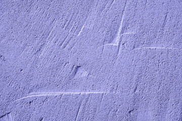 Old wall texture background painted and scratched. photo toned in the color of the year very peri.
