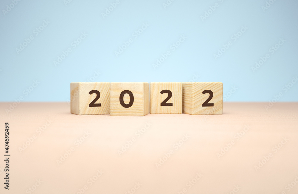 Poster new year 2022 wooden cubes in 3d rendering on a minimal background. holiday illustration for poster 