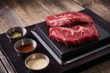 Raw beef meat with sauce and spices