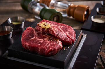 Raw beef meat with butter and spices