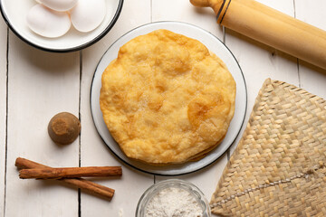 Christmas fritters with piloncillo and cinnamon on a white background. Mexican food