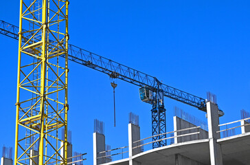 Crane and highrise construction site