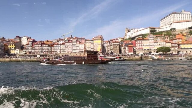 The city of Porto in Portugal. The Douro River with a boat on the water