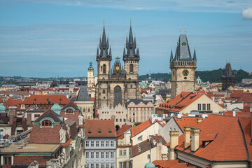 Naklejka na ściany i meble Cityscape of Prague and many of it's famous buildings such as the Church of Our Lady before Týn and Prague Castle from a viewpoint at the Powder Tower - Prague, Czech Republic