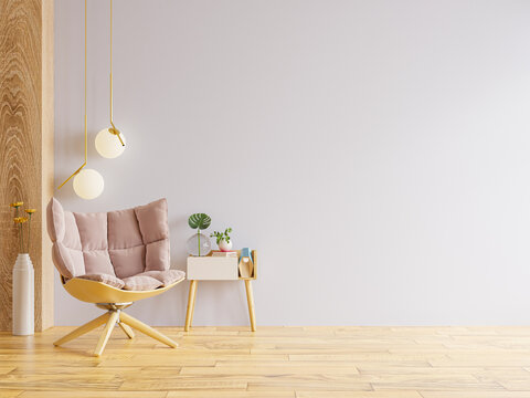 Modern minimalist interior with an armchair on empty light pink wall background.