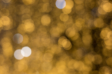 Christmas light background. Holiday glowing backdrop. Defocused Background With Blinking Stars. Blurred Bokeh.