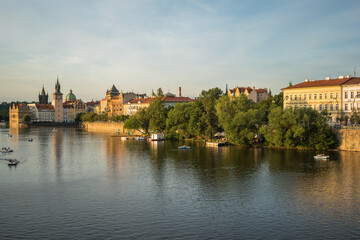Fototapeta na wymiar Prague, Czech Republic, June 2019 - beautiful sunset view of Prague by the Vltava River