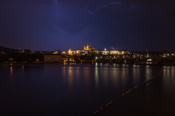 Fototapeta na wymiar Night view of Prague Castle and Charles Bridge during a rainstorm - Prague, Czech Republic