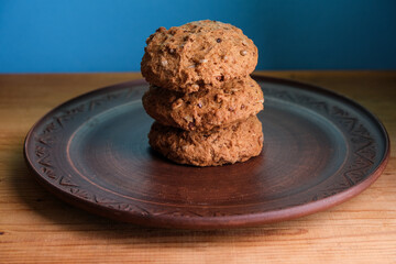 Still life with gingerbread cookies in a clay plate. 