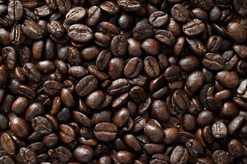 Coffee Beans Background. Dark freshly roasted coffee