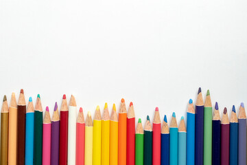 Color pencils isolated on white paper background