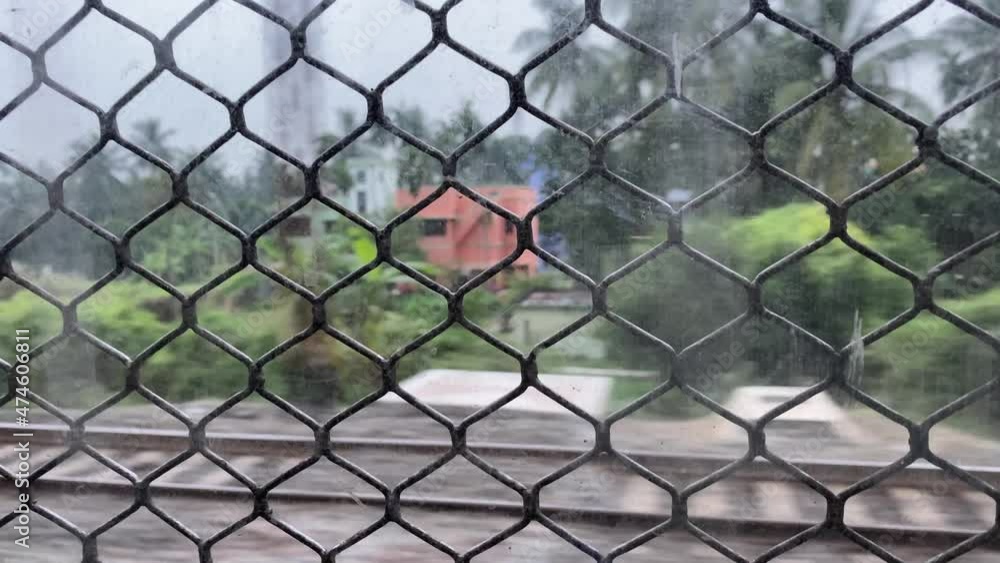 Poster view from local running train window in kolkata, west bengal. another fast train passing from opposi