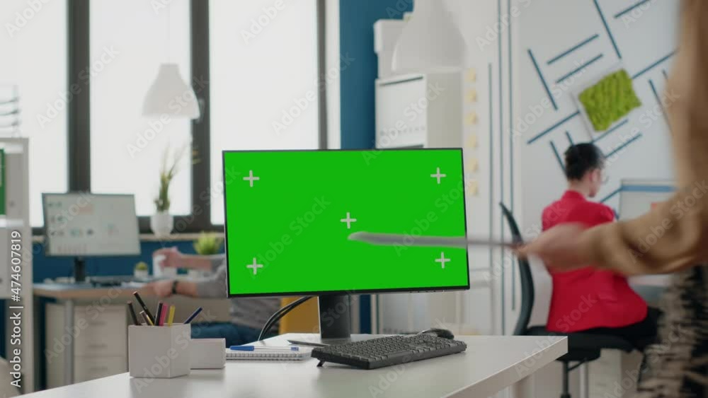 Poster company worker using computer with green screen in office. business woman working with mock up isola
