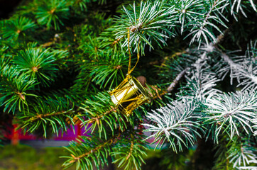 Fototapeta na wymiar pattern golden christmas decorations on fir branches