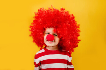 Let's celebrate! Funny kid clown playing at home. 1 April Fool's day concept.