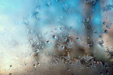 Waterdrops and rime on window glass