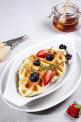 Homemade Croissant Waffle or Croffle with fruits and honey, easy making for breakfast.