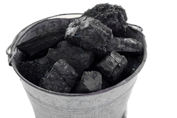 A bucket of black coal on a white background isolate, energy and heat in the house
