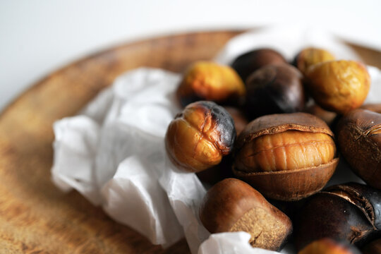 roasted chestnuts on a white background, winter