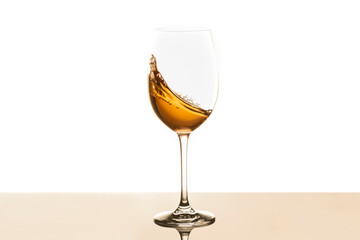 White wine swirling into glass. Selective focus