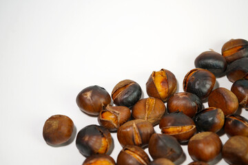 roasted chestnuts on a white background, winter
