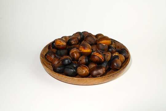 roasted chestnuts on a white background, winter