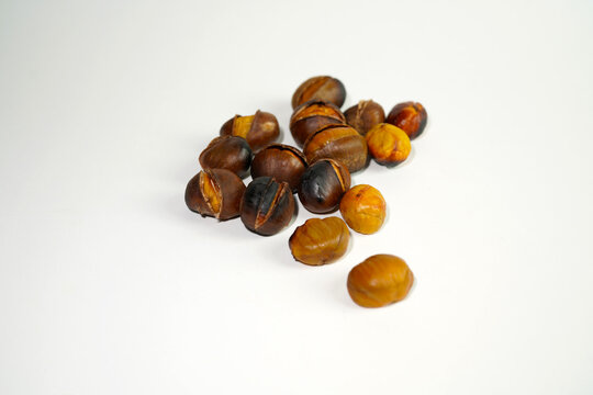 roasted chestnuts on a white background, winter
