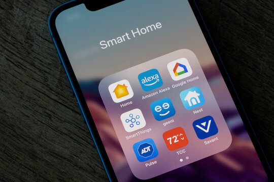 Portland, OR, USA - Dec 12, 2021: Assorted smart home apps are seen on an iPhone - Apple Home, Amazon Alexa, Google Home, SmartThings, Geeni, Nest, ADT Pulse, Honeywell Total Connect Comfort, Savant.