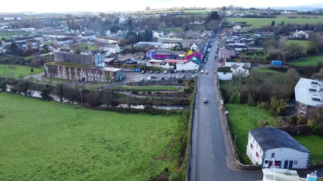 Aerial shot took by drone, flying over a village in Waterford, morning day in Kilmacthomas, Ireland.