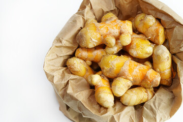 Fresh turmeric on white background,raw material for cooking. Close up.