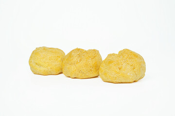 Delicious choux creams isolated on white background. Close up of French dessert.
