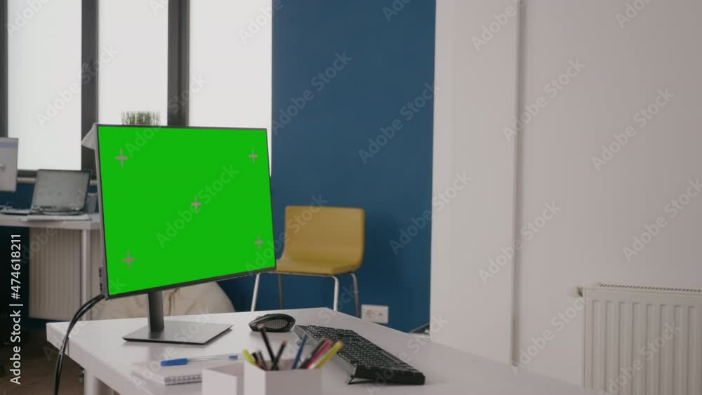Poster company worker using green screen on computer at desk. woman working with isolated mock up template 