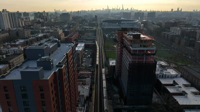 flying over crossing subway trains in the Bronx towards NYC skyline