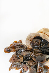 Fresh wood ear nushroom on white background,raw material for cooking. Close up.