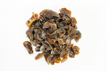 Fresh wood ear nushroom on white background,raw material for cooking. Close up.