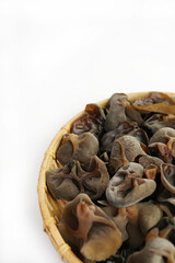 Fresh wood ear nushroom on white background,raw material for cooking. Close up.