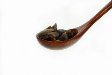 Fresh wood ear nushroom on white background,raw material for cooking. Close up.