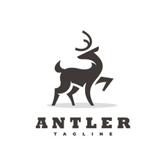 Simple standing, looking back deer silhouette. Standing deer buck stag reindeer vector logo icon